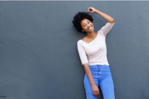 woman leaning against a wall